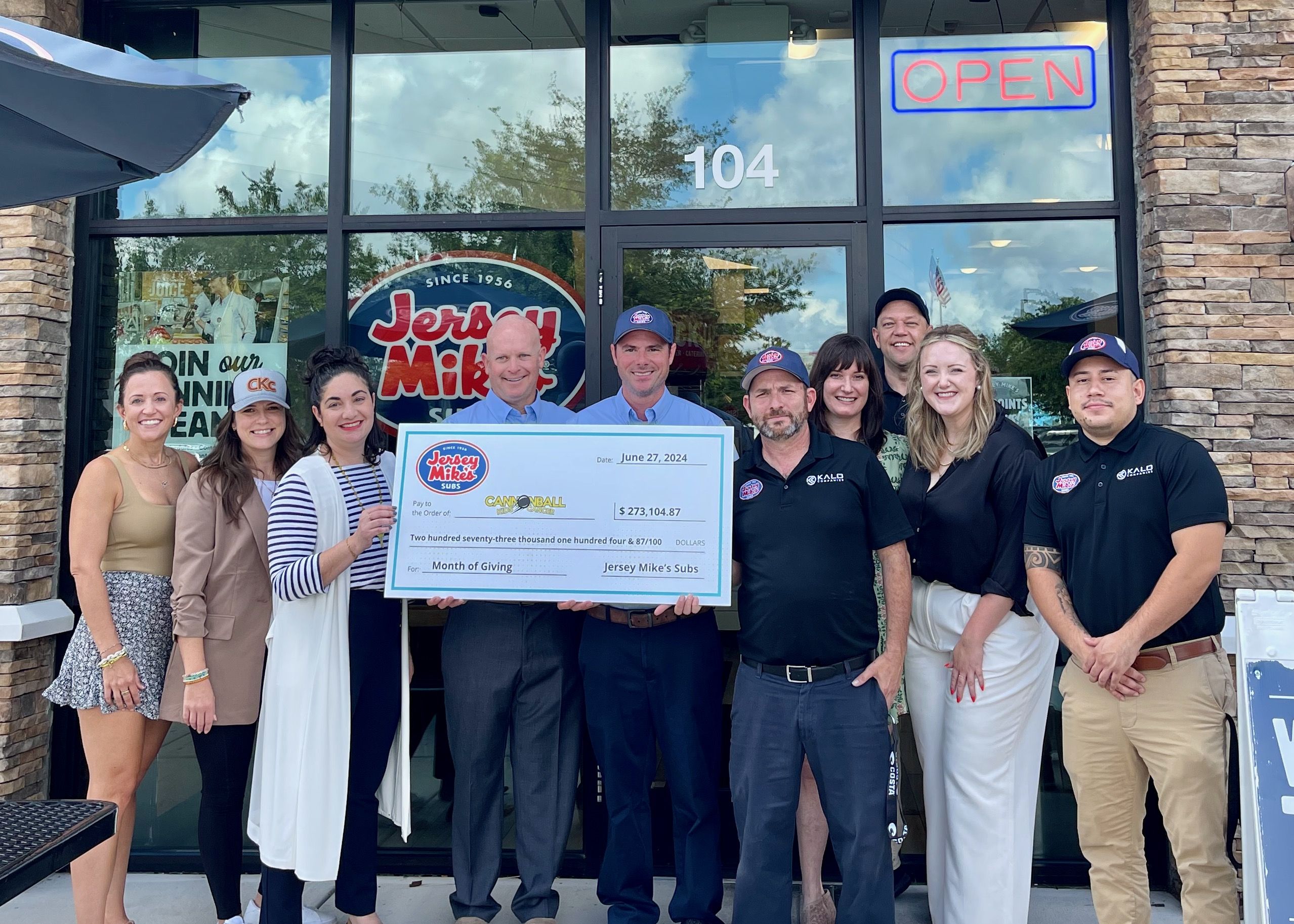 Check presentation photo with members of Cannonball and Jersey Mike's teams.